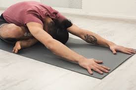 Young Man Training Yoga In Child S Pose Yoga Training Kid Poses Poses