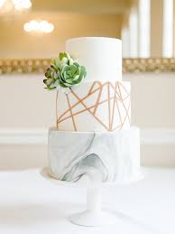 Fine Art Wedding Cakes Honey Crumb Cake Studio Seattle Bakery Custom Cakes Wedding Cakes This white cake is draped in platinum treats, including platinum necklaces, pins and pendants, and edible platinum flakes.