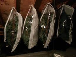 Genius Idea From Dawn Wallace 1 Entire Christmas Tree In 4 Garment Bags Hung On Nails Christmas Tree Storage Bag Christmas Tree Store Christmas Tree Storage