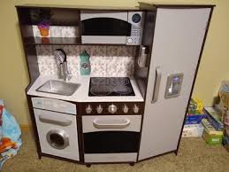 It has enough storage all over even if you're buying extra accessories. Kidkraft Large Play Kitchen With Realistic Lights And Sounds Espresso Silver Walmart Com Walmart Com