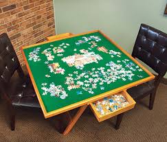 A Must Have For Every Puzzle Enthusiast This Exclusive Puzzle Table Features Premium Wood With A Non Slip Jigsaw Puzzle Table Puzzle Table Woodworking Jigsaw