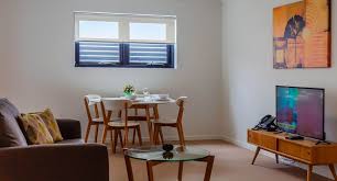 Matching fabric in dining room chairs and lounge suite. Morgan Suites Brisbane Brisbane Price Address Reviews