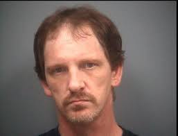 Man charged with threatening to shoot two men