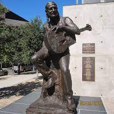 An 8 foot tall statue of willie nelson was unveiled on 2nd street in downtown austin today. Austin Willie Nelson Statue Statue Willie Nelson Outdoor Sculpture