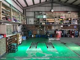 Old Car Repair Shop Interior With Mechanic In Background Auto Repair Shop Shop Interior Auto Repair