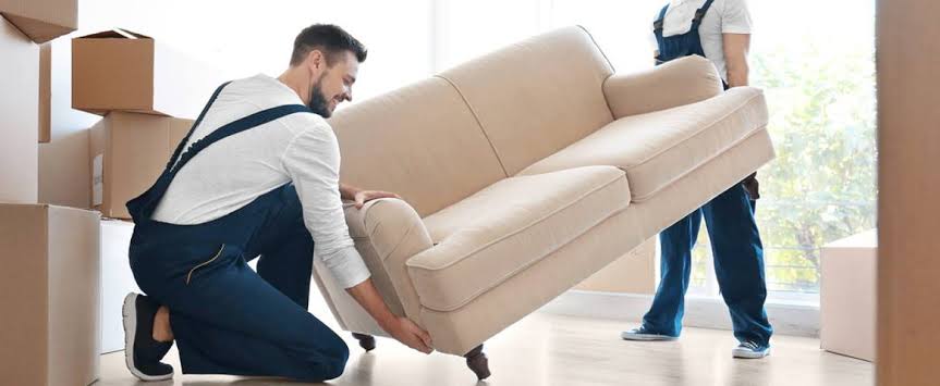 EasyGo team collecting an old sofa from a home in Mauritius as part of TFP Furniture Exchange