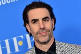 'i was tucking in my shirt'. Sacha Baron Cohen Mocks His Borat 2 Target I Hired Rudy Giuliani To Sue The Golden