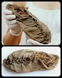 Archaeologists excavating the defensive “ankle-breaker” ditches at Magna  Fort uncovered a remarkable artifact: a 2,000-year-old giant shoe, perfectly  preserved in the oxygen-poor soil. The find immediately astonished the team.  The shoe measures