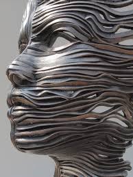 Perceiving The Flow Human Figures Composed Of Unraveling Stainless Steel Ribbons By Gil Bruvel Sculpture Steel Sculpture Sculpture Art