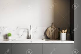 white marble kitchen sink standing on