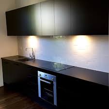 Matte Black Formica Laminate And White Subway Tiles Add Drama To This Galley Kitchen Matte Black Kitchen Black Kitchens Kitchen Renovation