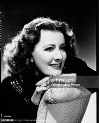 696 Irene Dunne Wearing Photos & High Res Pictures