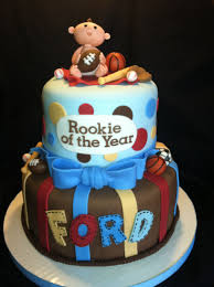 Sports Themed Baby Shower Cake Baby And Other Decorations Are Fondant Baby Shower Cakes Shower Cakes Sports Baby Shower Theme