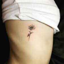 And, of course, sunflower tattoos represent a longevity and a flexibility. Single Needle Sunflower Tattoo On The Rib