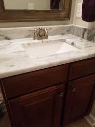 The sink is an undermount rectangular sink with a deep bowl. Bathroom Vanity Paint Color With Marble Countertop