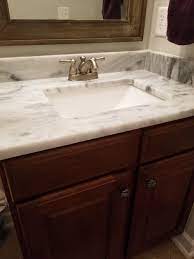 The sink is an undermount rectangular sink with a deep bowl. Bathroom Vanity Paint Color With Marble Countertop