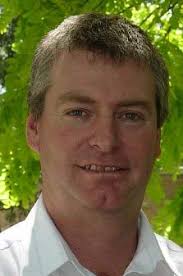 FROM BEHIND THE DESK