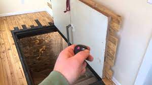 Expanded metal interior sidewalk door can be made inside of frame opening to allow ventilation and maintain security. Guy Uses A Homemade Remote Controlled Door Opener To Open His Secret Hidden Basement Door Youtube