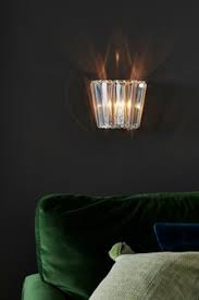 Offering a visual appeal as well infusing a tranquil feel, explore wall light fixtures in chrome, black and sliver , lighting up your space. Indoor Lighting Indoor Wall Lights Next Uk