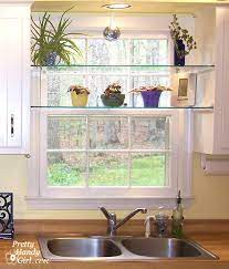 On top of the cabinets, via one kings lane: Diy Glass Window Shelves Pretty Handy Girl