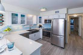 Usually, it is a combination of white colors and wooden features. Modern White Kitchen Renovation From Beach Flip Beach Flip Hgtv
