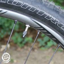 Once the tire is fully inflated, remove the air pump, remove the adapter, and finger tighten the locknut. How To Inflate Mountain Bike Tire With Presta Valve Diy Mountain Bike
