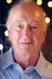 Dennis E. Woll 1947-2021