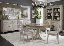 The antique white finish offers a beautiful contrast to a darker background to brighten up any formal dining room. Farmhouse Reimagined Antique White Extendable Oval Dining Room Set 1stopbedrooms