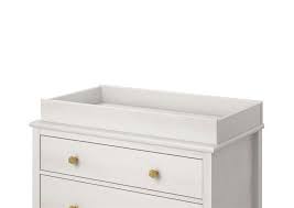 A changing table is a small raised platform designed to allow a person to change someone's diaper. Monarch Hill Poppy Changing Table Topper Ivory Oak Little Seeds