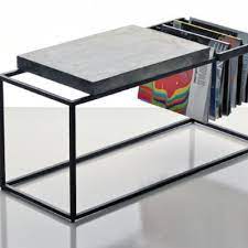 They usually come with a wood frame and either a wood board along the top or a glass top. Magazine Storage 12 Tables And Stools That Can Help Organize Publications Core77