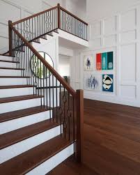 Floating stairs with a clear glass railing lead the way to the home's second level. Get The Look The Ultimate Mid Century Modern Staircase