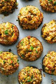 In this recipe, classic stuffed mushrooms become an excellent vegetarian thanksgiving if you're lucky enough to have leftover thanksgiving stuffing, you can use it in place of the cornbread mixture. Stuffing Stuffed Mushrooms Recipe Recipe Nyt Cooking Thanksgiving Appetizers Stuffed Mushrooms