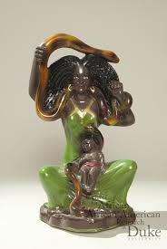 Santa Marta la Dominadora statue with black child