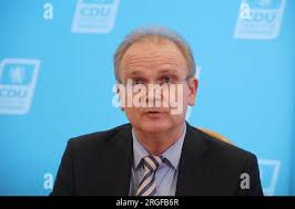 Erfurt, Germany. 09th Aug, 2023. Frank Salinger, an expert from the Ludwig  Maximilian University in Munich, shows the report at a press conference of  the CDU faction and the FDP group in