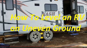 After you drive your rv up onto the wedges, you just stop and then place the matching wheel chock into position. How To Level An Rv On Uneven Ground Off Road Camping Youtube