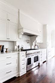 Walzcraft's custom wood range hood are each unique in design and available in many sizes. White French Kitchen Hood With Corbels And White Marble Slab Backsplash White Interior Design Kitchen Kitchen Design Best Kitchen Designs