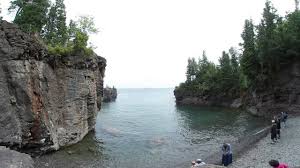 Aside from the height, the dark color of the cliffs adds a dramatic landscape to the shoreline along the tip of presque isle park. Black Rocks Jumpers At Presque Isle Park Marquette Michigan Youtube