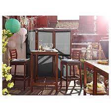 The product with a glass top looks stylish and beautiful for its modern design. Applaro Bar Table Outdoor Brown Stained Ikea