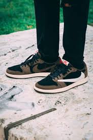 Next, the pair will come with white on the panels, toe, laces, tongue, and midsole while a white backwards swoosh lands on the lateral side and an obsidian swoosh covers. On Feet With Travis Scott S Air Jordan 1 Low Sneaker Air Jordans Travis Scott Outfits Jordan 1 Low