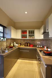 Modular kitchen is the ongoing trend in modern homes. Beige Color Modular Kitchen With Tiled Wall And Cabinets Homes Homedecor Homedeco Kitchen Interior Design Decor Trendy Kitchen Tile Modular Kitchen Design
