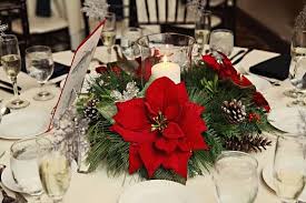 A collection of small votive candles adds even more beauty to this show stopper. Pin By Something Floral On Winter Weddings Flower Centerpieces Wedding Christmas Wedding Centerpieces Centerpiece Wedding Flower Arrangements