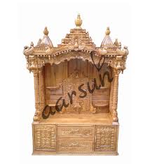 Pooja spaces are an essential part of a home in today's apartment plans. Handcrafted Wood Temple Cabinet Mndr 0012