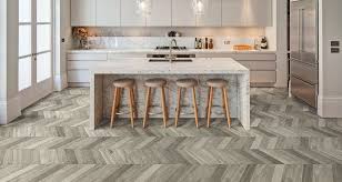 Unlike wood, it doesn't gain character and can't be sanded. Pin By Bauzentrum Zillinger On Herringbone Pattern Small Modern Kitchens Kitchen Flooring Kitchen Floor Tile