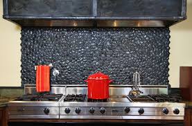 Stones and pebbles can be used instead of tiles and they will give your backsplash a unique look. Island Stone Medan Charcoal Perfect Pebble Backsplash Modern Kitchen Other By Island Stone Houzz