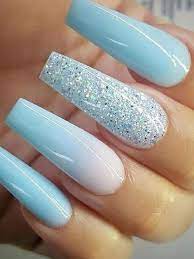 Next time you're in the mood for nail art, paint all ten nails and try giving just one of them a little extra pizzazz. Cute Spring Nail Ideas And Nail Art Best Of The Season From 24 To 22 Blue Glitter Nails Sparkly Acrylic Nails Blue Acrylic Nails Glitter
