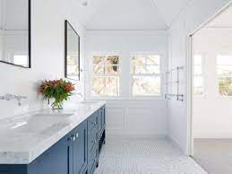 You might not be used to seeing such a tile in a classic hamptons home. Stritt Design Construction Mosman Residence Traditional Coastal Home Hamptons Style Navy Hampton Style Bathrooms Bathroom Interior Traditional Bathroom