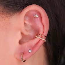 flat double conch and double lobe piercings pierced by afabrii image via afabrii earings piercings cute ear piercings ear piercings