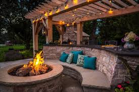 outdoor stone kitchen design with pool