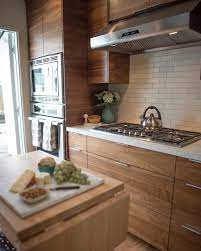 Kitchen With Horizontal Grain Walnut Cabinets Cream Heath Ceramics Subway Tile And Quartz Counter Walnut Kitchen Cabinets Walnut Kitchen New Kitchen Cabinets