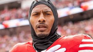 Ed Hochuli, former NFL referee, gets his own bobblehead and bobblearm